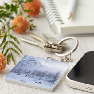 Winter wonderland, fog, spruce forest and mountain keychain