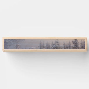 Winter wonderland, fog, spruce forest and mountain topple tower