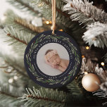 Winter Wreath | Baby's First Christmas Photo Ceramic Ornament<br><div class="desc">A perfect gift for new parents, this elegant Christmas ornament features front and back photos encircled by a wreath of dark green leaves and red berries. "[Name's] first Christmas" curves over the top of each photo, with the year beneath. Customize with a favorite photo on each side to create a...</div>