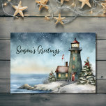 Wintery Lighthouse Season's Greetings Christmas Holiday Card<br><div class="desc">Celebrate the season with our Wintery Lighthouse Season's Greetings Christmas Holiday Card. The watercolor design captures the charm of a wintertime lighthouse scene, radiating warmth and nostalgia. Send your heartfelt wishes amidst the serene beauty of snowflakes and twinkling lights. Share joy and good tidings with this beautifully crafted card, a...</div>