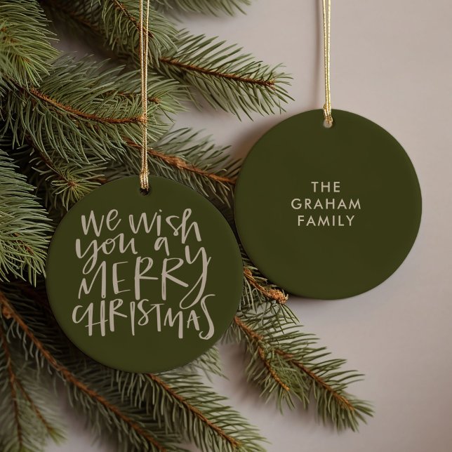 "Wish You a Merry Christmas" Evergreen Ceramic Ornament (Hand-lettered We Wish You a Merry Christmas carol family name green ornament)