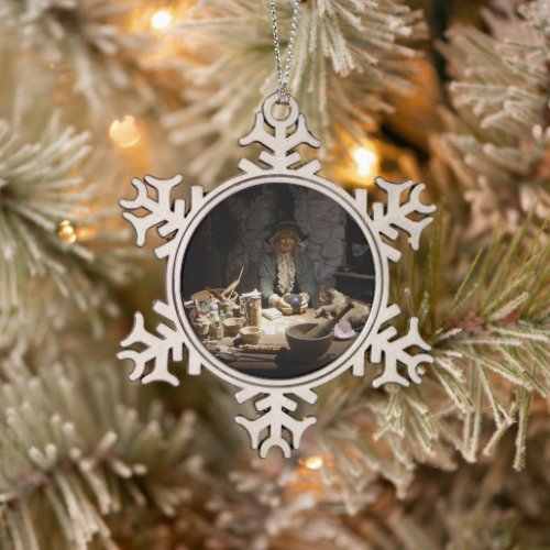 Witchcraft Museum display of a Witch Snowflake Pewter Christmas Ornament