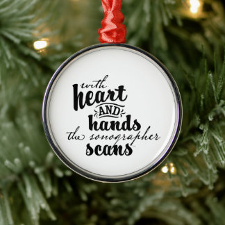 With Heart and Hands the Sonographer Scans Metal Ornament