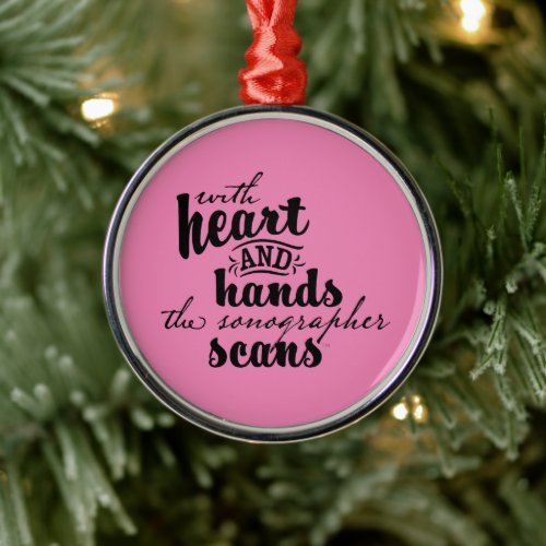 With Heart and Hands the Sonographer Scans Metal Ornament
