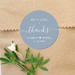 With Love And Thanks Dusty Blue Wedding Thank You Classic Round Sticker<br><div class="desc">Chic dusty blue thank you sticker for your wedding reception favors and thank you cards featuring "With Love   Thanks" in simple white typography and an elegant white script with swashes,  your first names joined together by a heart and your wedding date.</div>