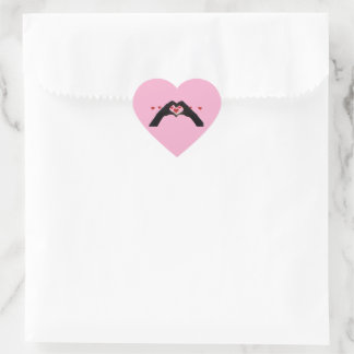 "With the heart in hand" poses a glass Sticker