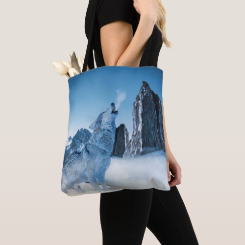 Wolf Howling on a Snowy Mountain in Winter Tote Bag