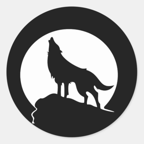 Wolf howling with a full moon round sticker