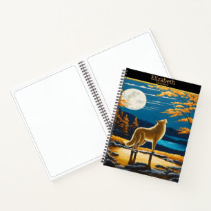 Wolf howls at the moonlit night notebook