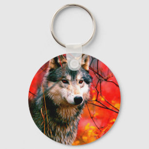Wolf peeking through leaves in a forest keychain