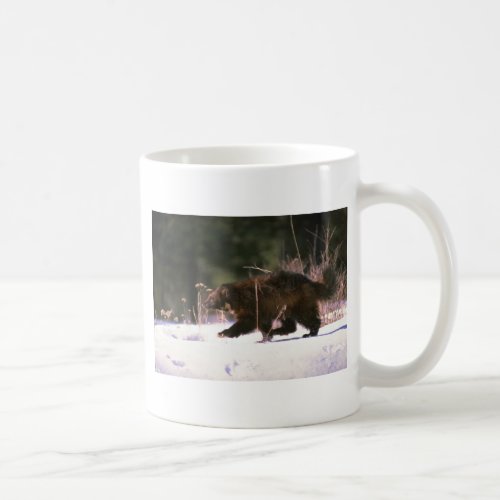 Wolverine running through snow coffee mug