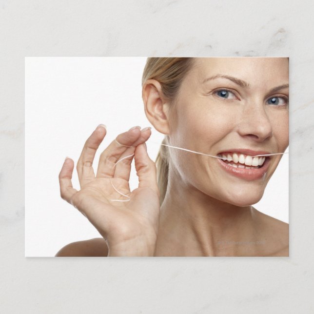Woman against white background flossing teeth, postcard (Front)