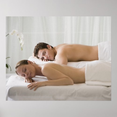 woman and man lying on massage benches poster