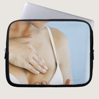 Woman doing breast self exam 2 laptop sleeve
