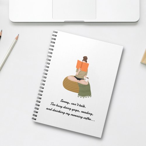 Woman Doing Yoga on Poof Reading White Notebook