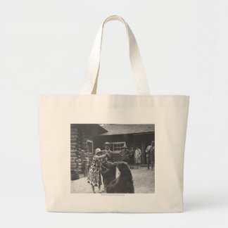 Woman feeding bears. large tote bag