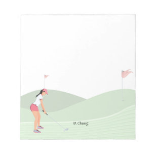 Woman golfer is golfing on the course notepad