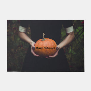 Woman Holding a Halloween Pumpkin Doormat