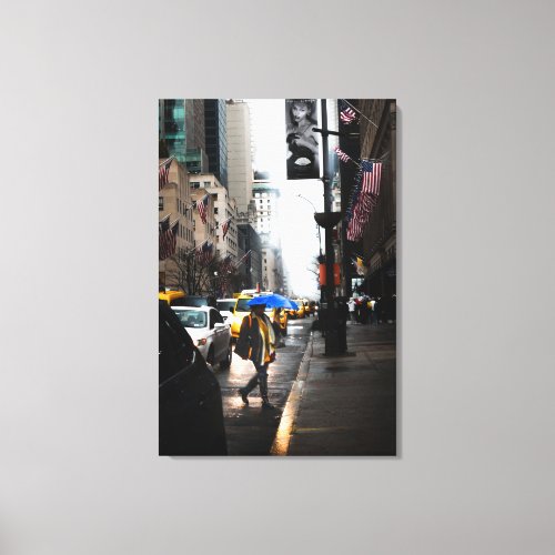Woman Holding Blue Umbrella Walking in Street  Canvas Print