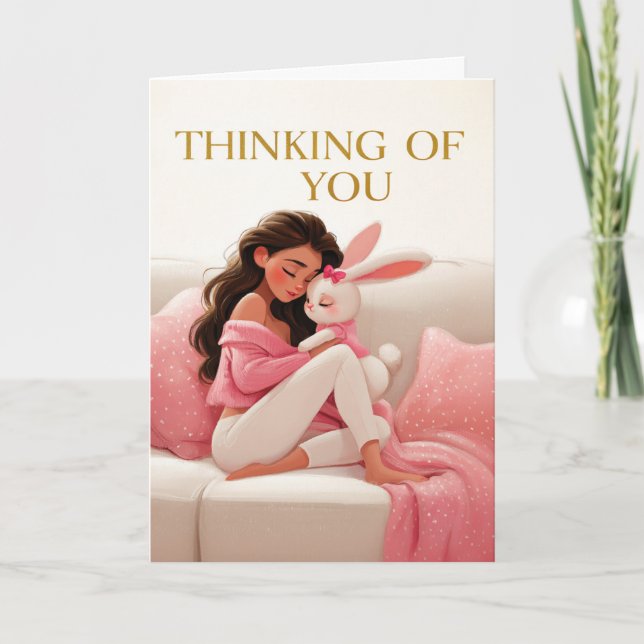 Woman Hugging Bunny on Couch Thinking of You Card (Front)