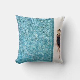 Woman in black bikini bottom and white sun hat sta throw pillow
