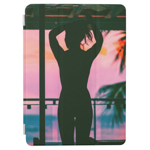 WOMAN IN BLACK TANK TOP AND PANTS STANDING ON BLAC iPad AIR COVER