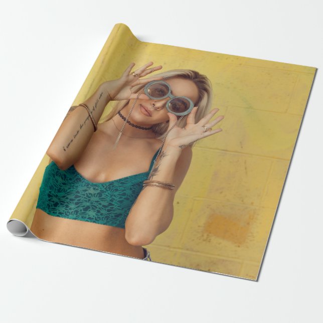 Woman in blue bralette holding sunglasses putting  wrapping paper (Unrolled)