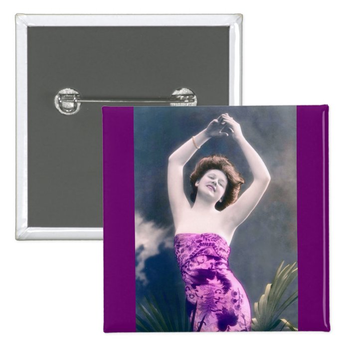 woman in purple sarong , arms raised as if dancing pins