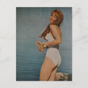 Woman in White Swimsuit on the beach in 1957 Postcard