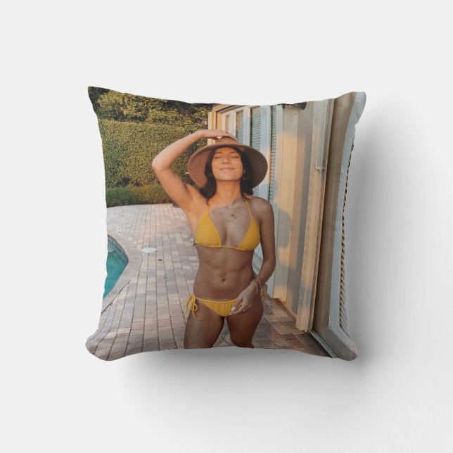 Woman in yellow bikini standing on brown brick flo throw pillow (Front)