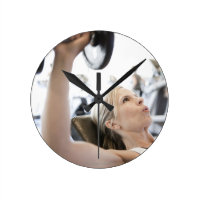 Woman Lifting Weights Round Clock