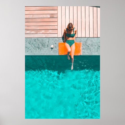 Woman lying beside swimming pool in the morning poster