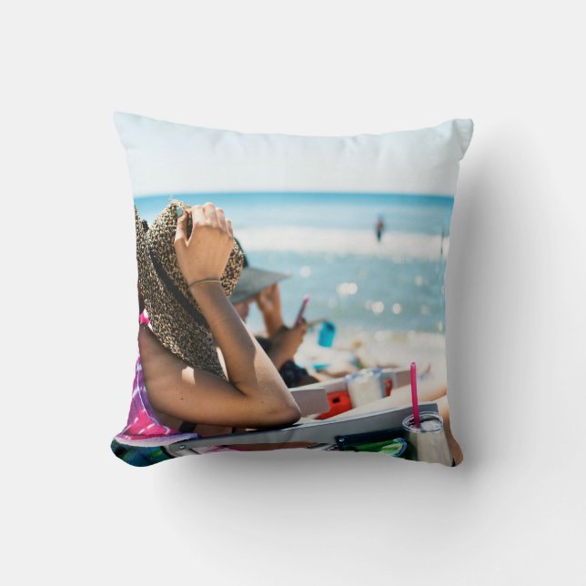 Woman lying on sun lounger covering her face with  throw pillow (Front)