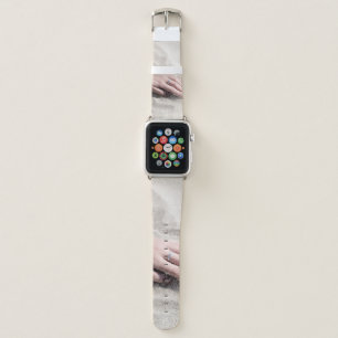 Woman lying on white sand apple watch band