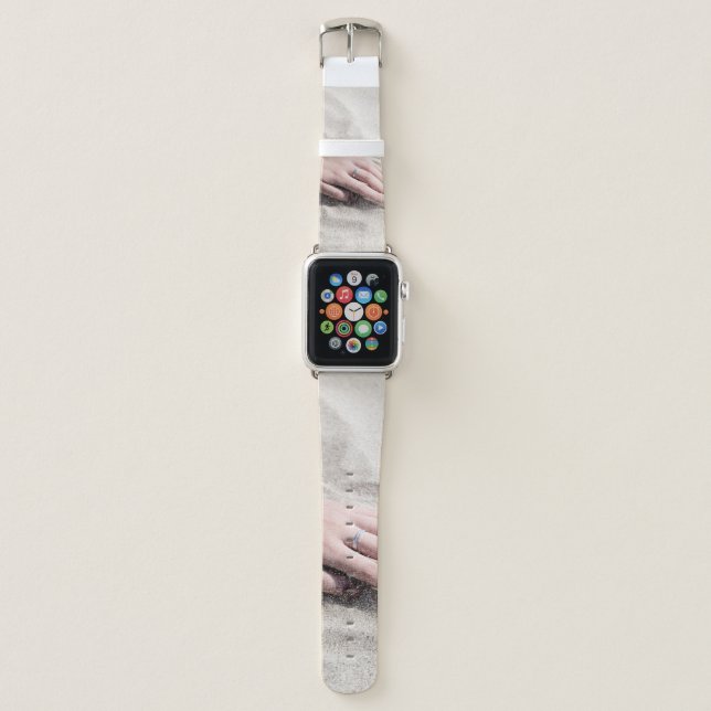 Woman lying on white sand apple watch band (Front)