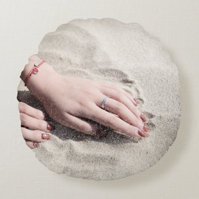 Woman lying on white sand round pillow (Front)