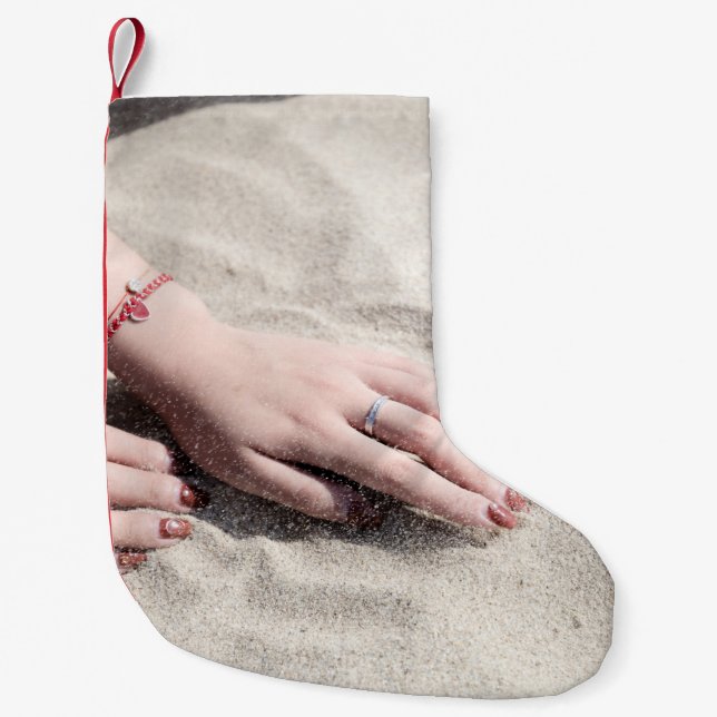 Woman lying on white sand small christmas stocking (Front)