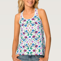 Woman modeling a colorful tank top with a vibrant