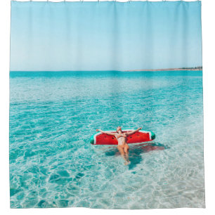 Woman on lilo in the sea water. Girl relaxing on i Shower Curtain