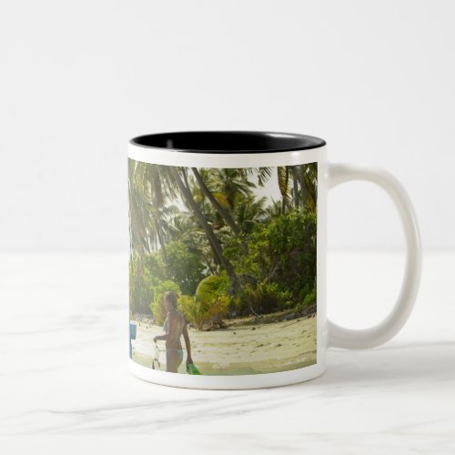 Woman on small traditional fishing boat Two_Tone coffee mug
