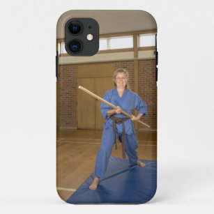 Woman performing Ken-Do-Kai Karate, smiling, iPhone 11 Case