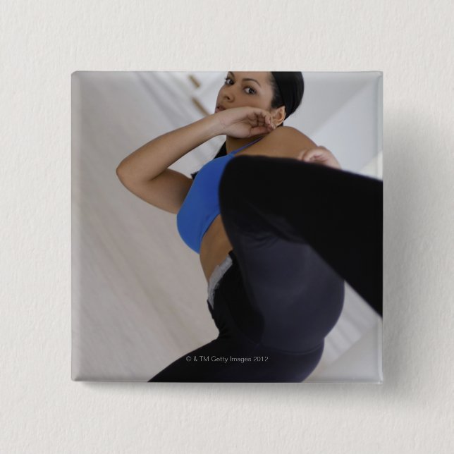 Woman performing martial arts pinback button (Front)