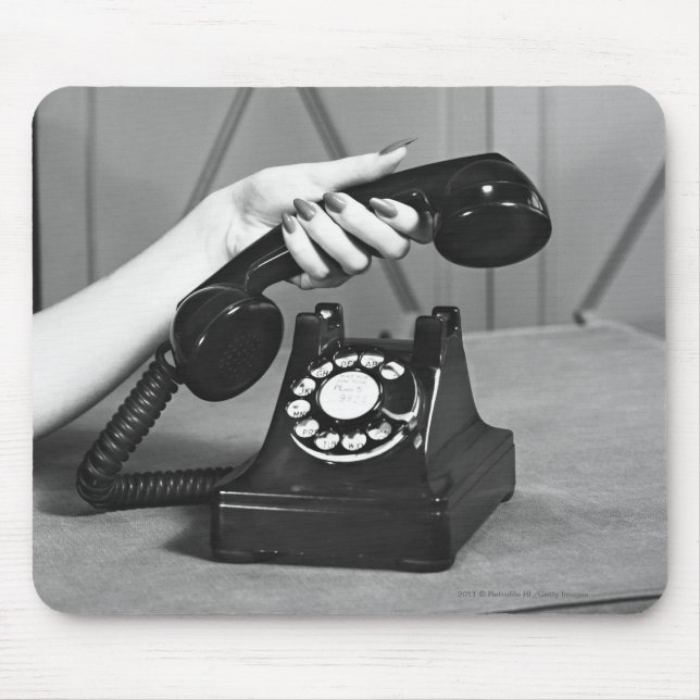 Woman picking up phone close up of hand mouse pad (Front)