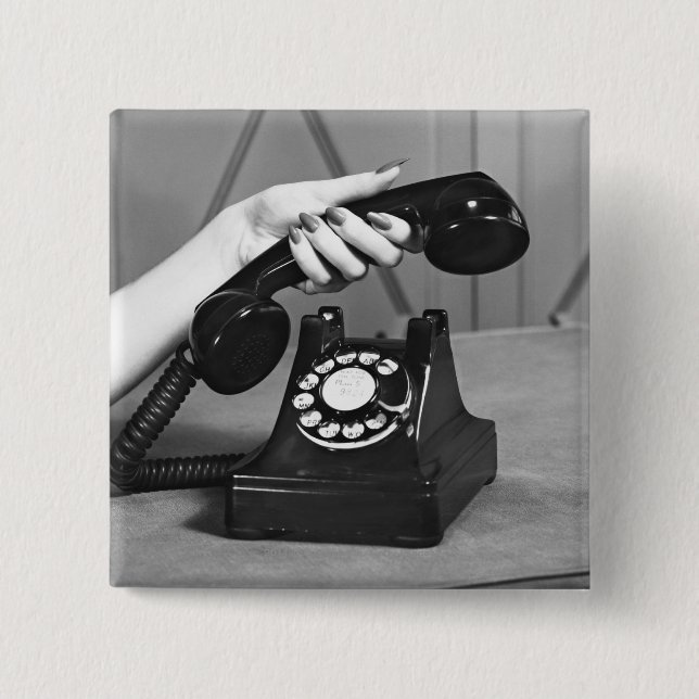 Woman picking up phone close up of hand pinback button (Front)