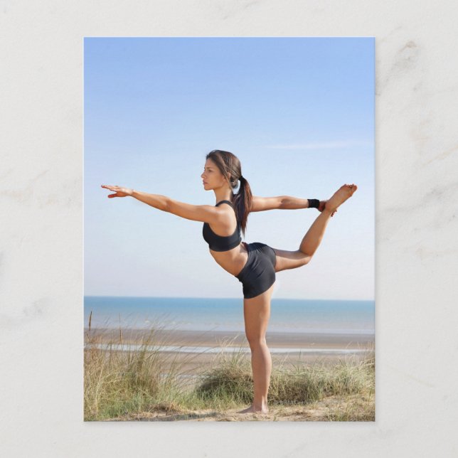 Woman practicing yoga on beach postcard (Front)