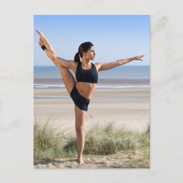 woman practicing yoga on beach wearing postcard (Front)