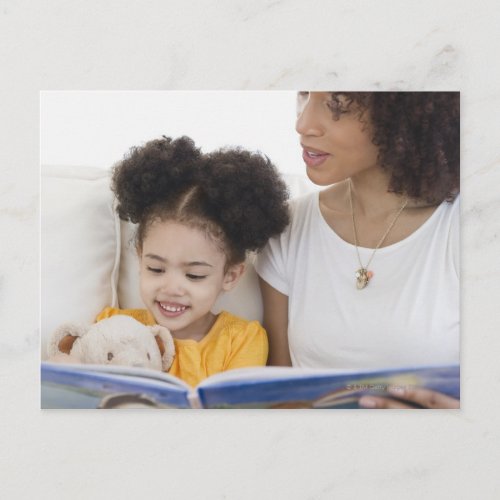 Woman reading book with daughter postcard