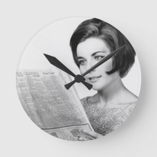Woman Reading Newpaper Round Clock