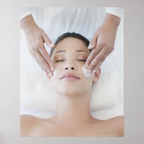 Woman receiving facial massage poster