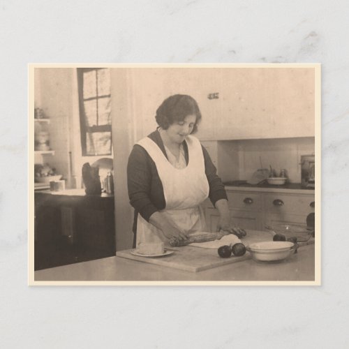 Woman rolling dough in a vintage kitchen postcard